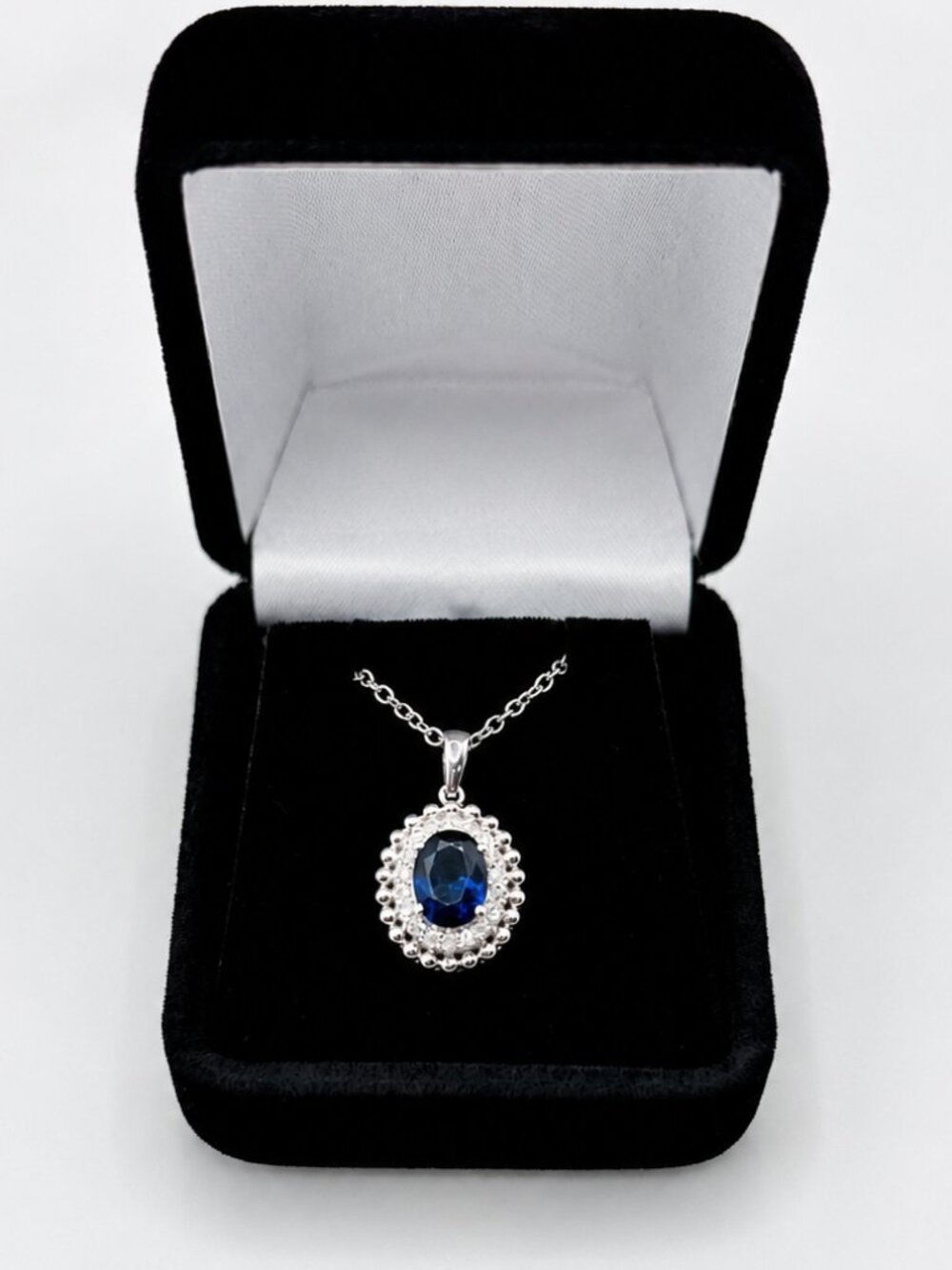 18 Inch Lab Grown Oval Sapphire Necklace with Lab Grown Diamond Halo in Sterling